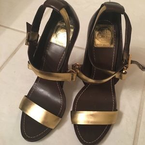 Brown and gold strappy heels.